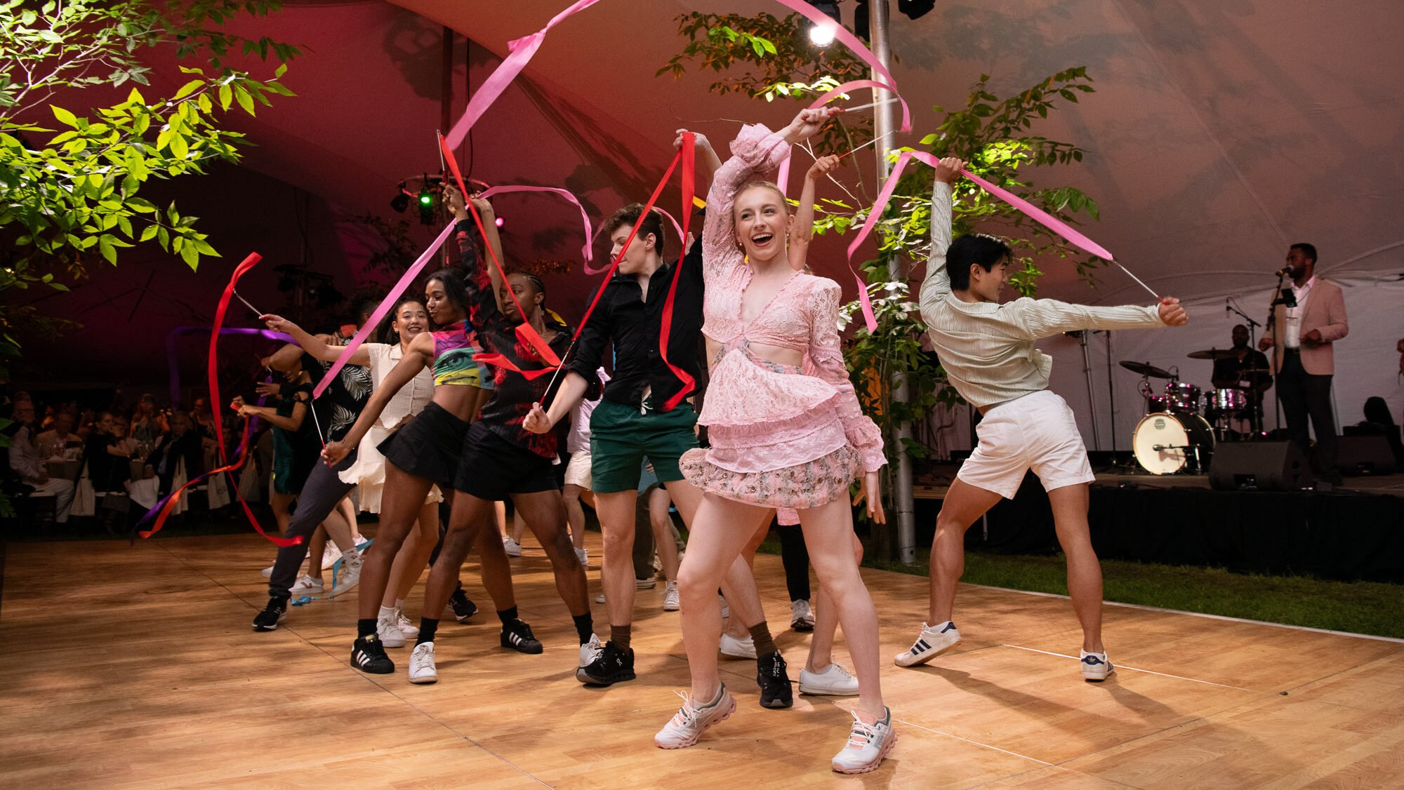 A photo from inside the Gala tent at the Summer 23 Gala. The School at Jacob's Pillow Contemporary Ballet Program is performing with ribbons.